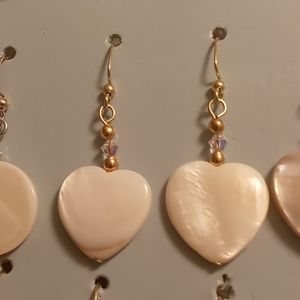 Mother of pearl heart earrings with gem stone.